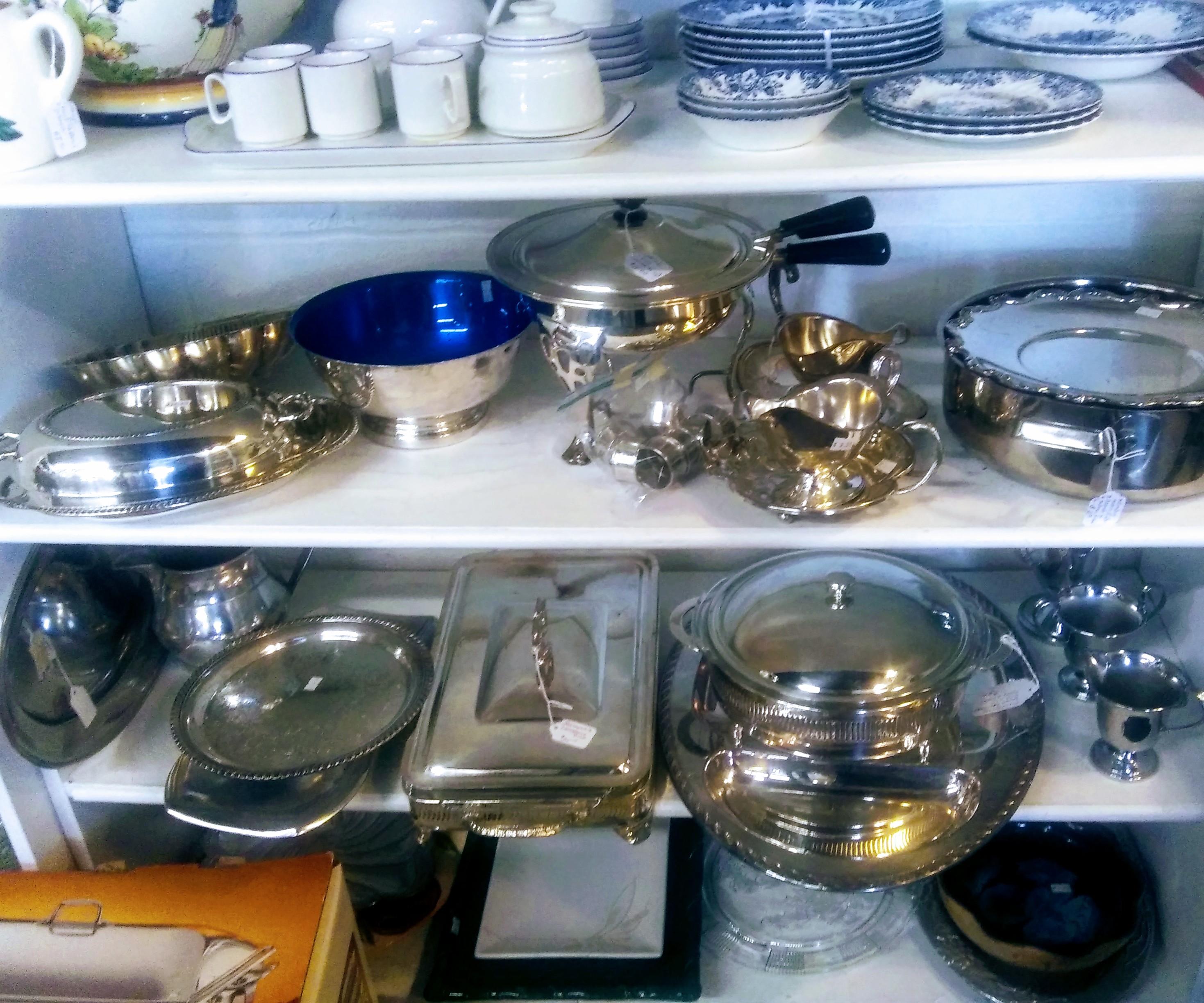 Shelves of Silver Plated Dishes