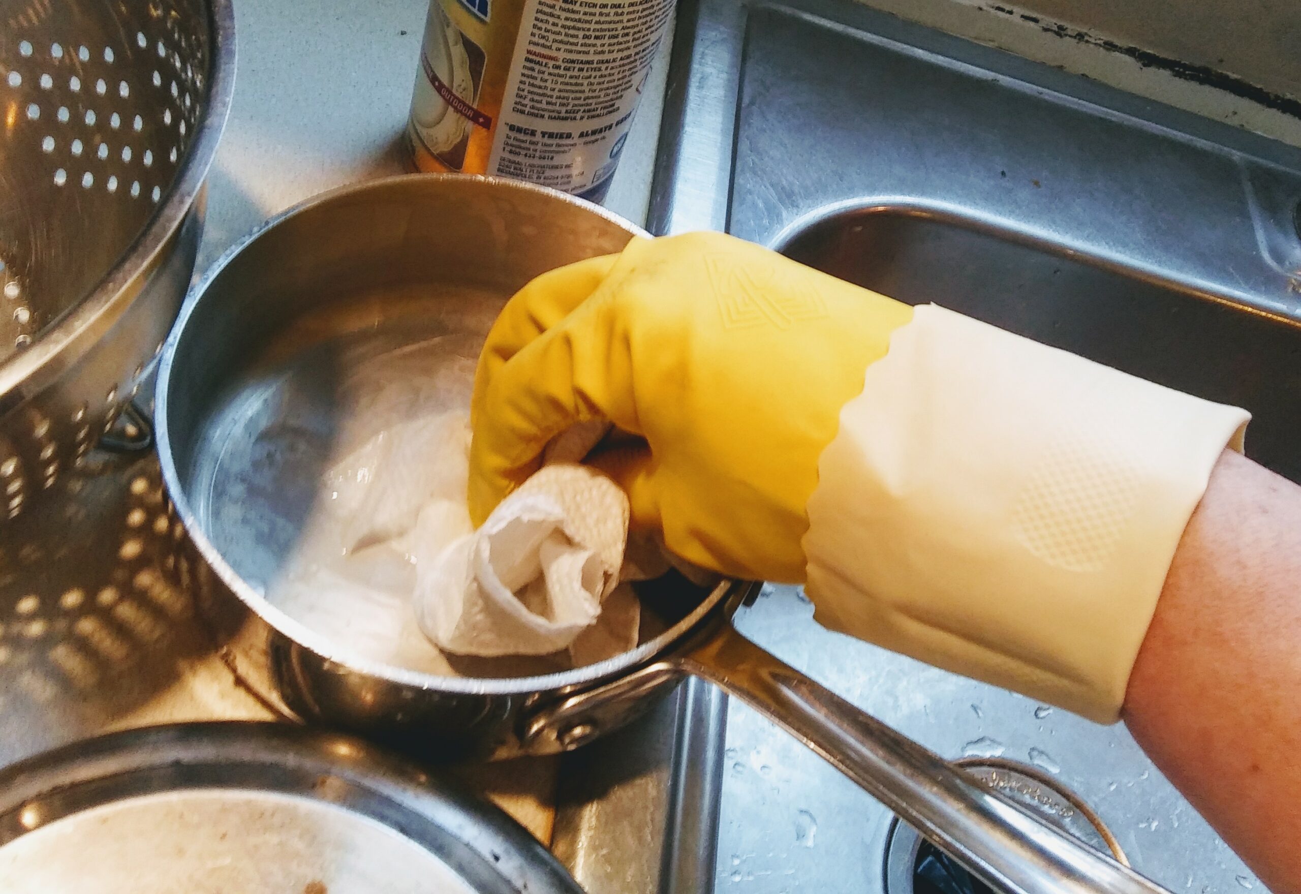 Scrubbing and Polishing Pots and Pans with a Paper Towel