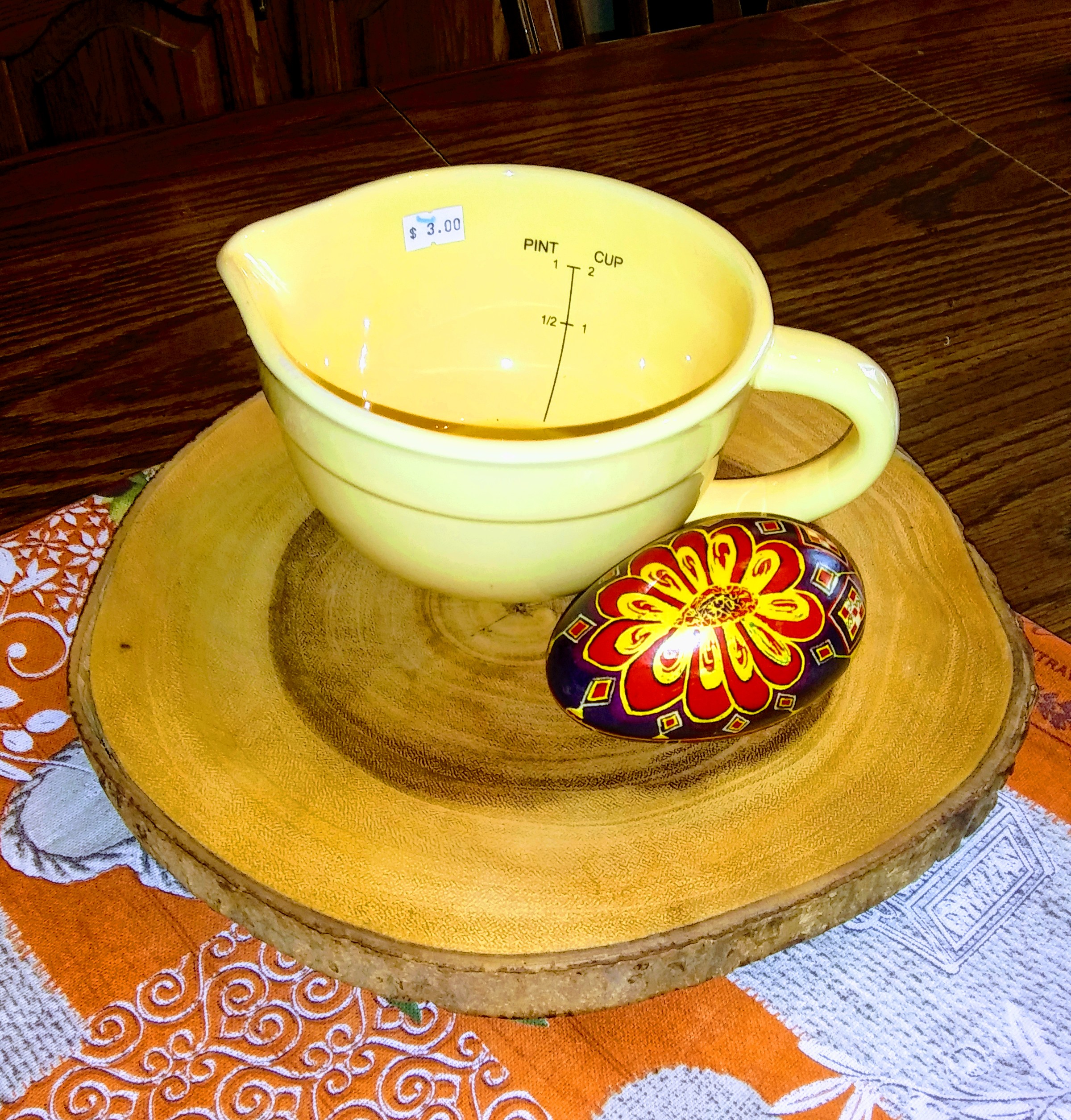 Measuring Cup, Decorative Egg and Circular Tablecloth