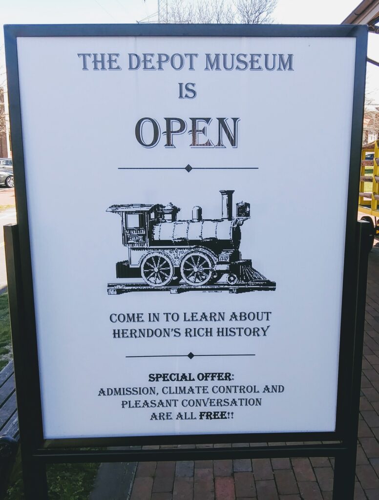 Open Sign in Front of the Museum