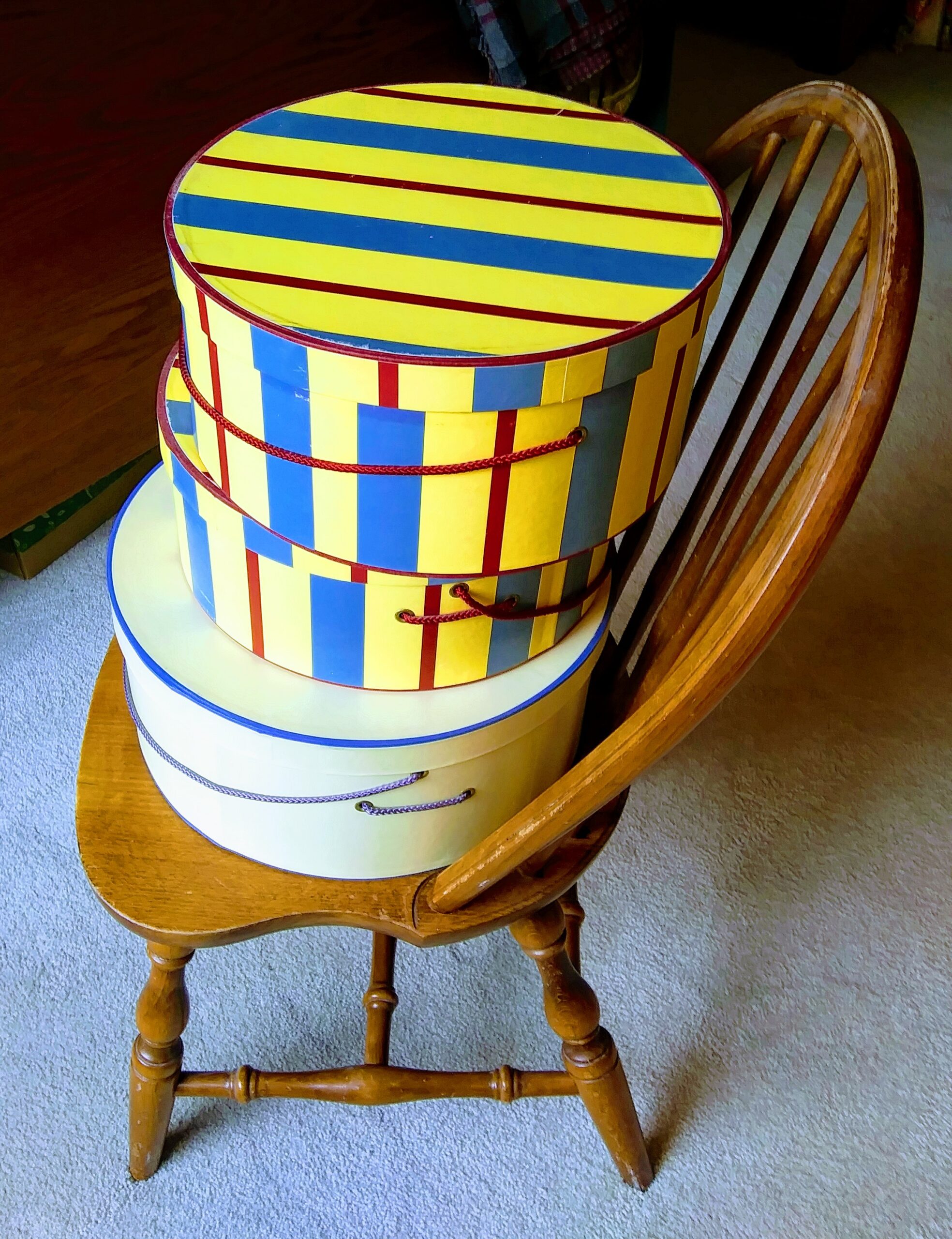 Colorful Hat Boxes on Chair