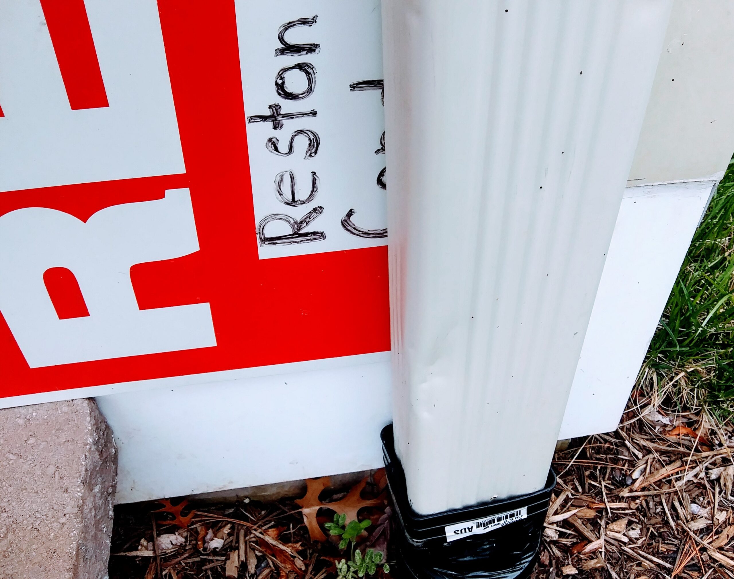 Re-purposing Plastic Sign for Water Overflow