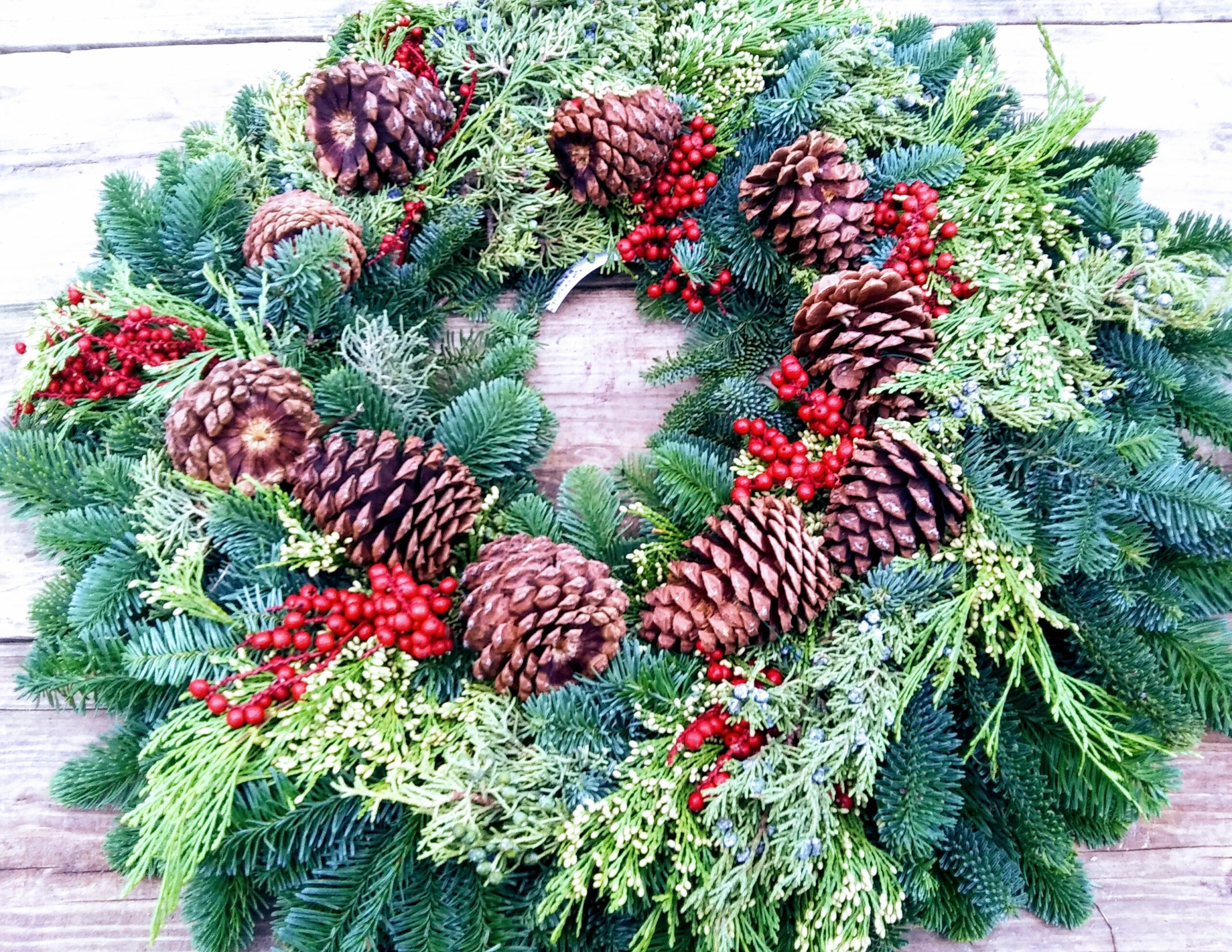 Fresh Wreath with Pinecones and Red Berries