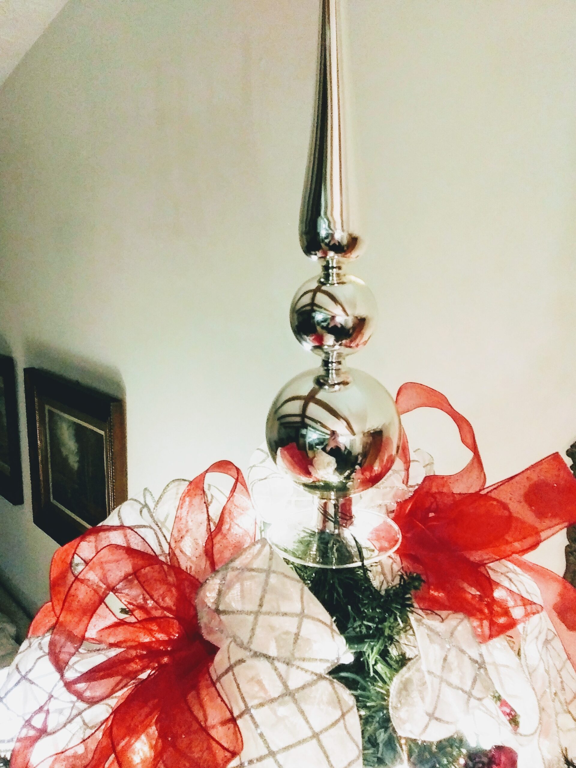 Attaching Red and White Tree Topper Bow