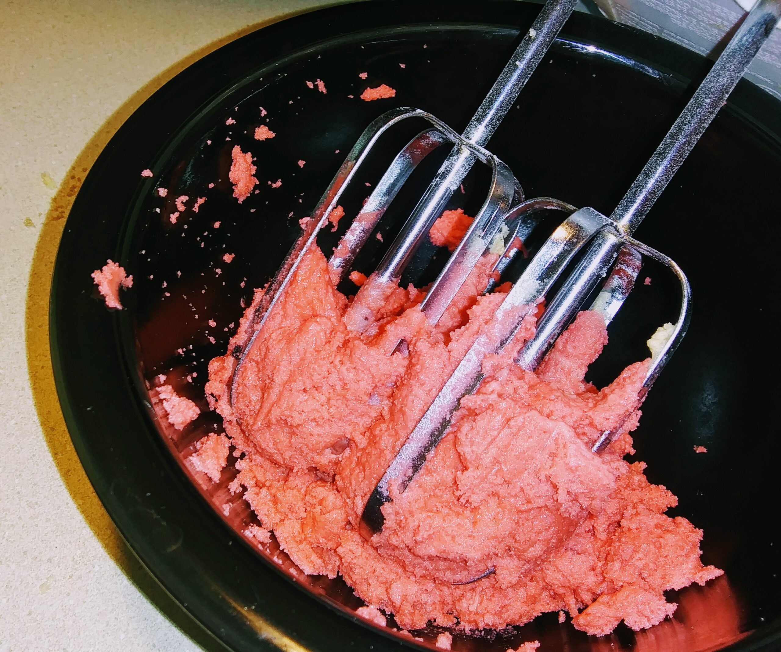 Mixing in the Red Food Coloring