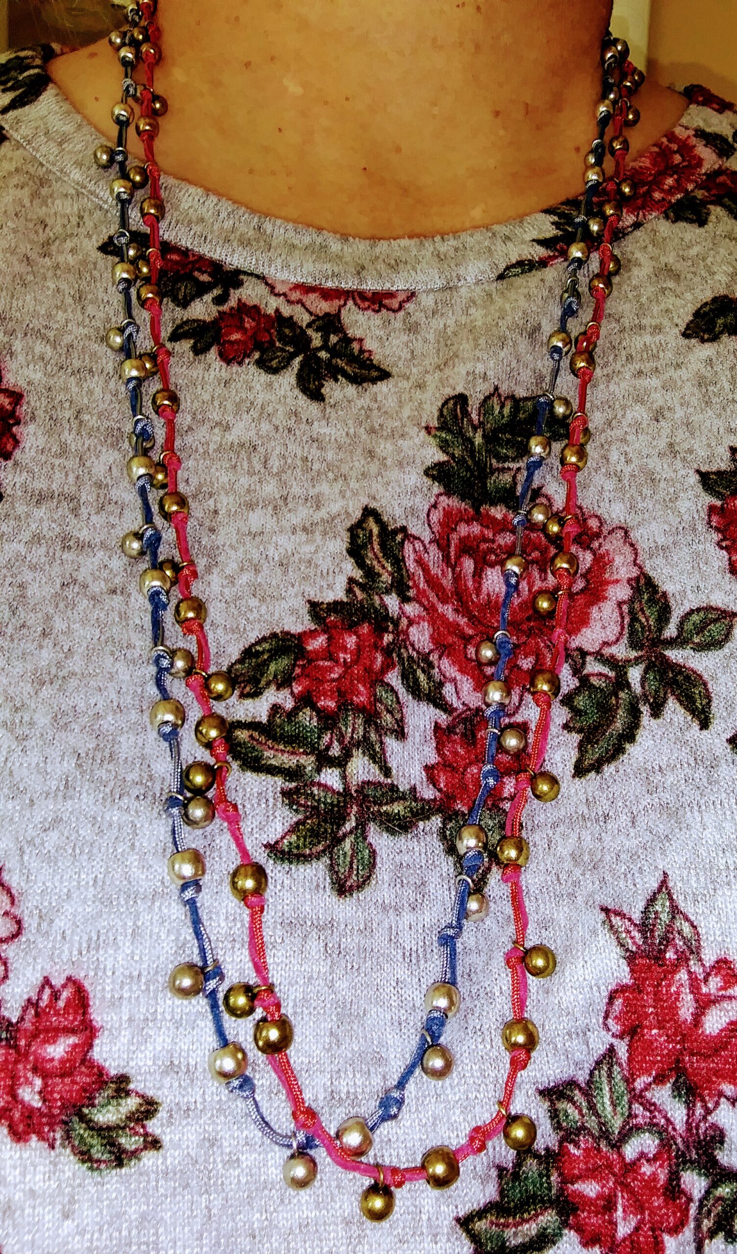 Wearing Two Knotted Beaded Necklaces