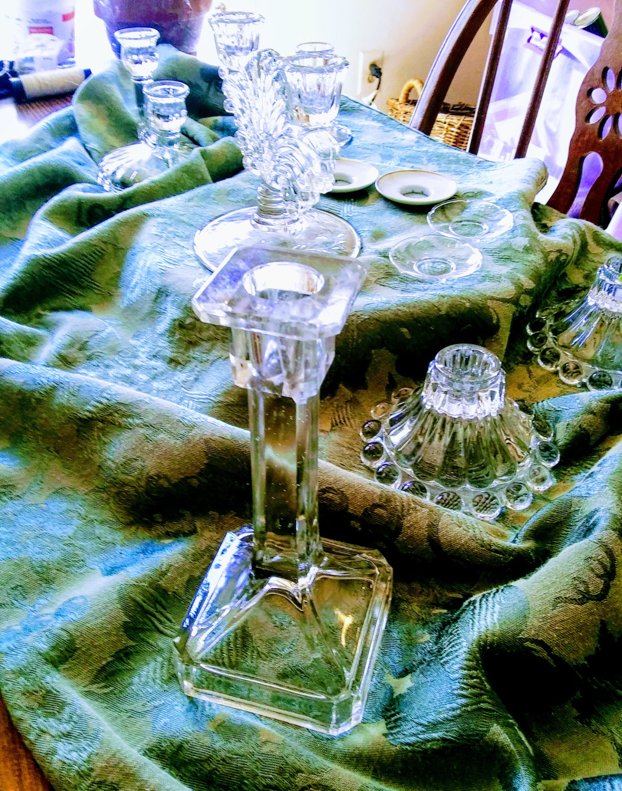 Candlesticks on Green Tablecloth