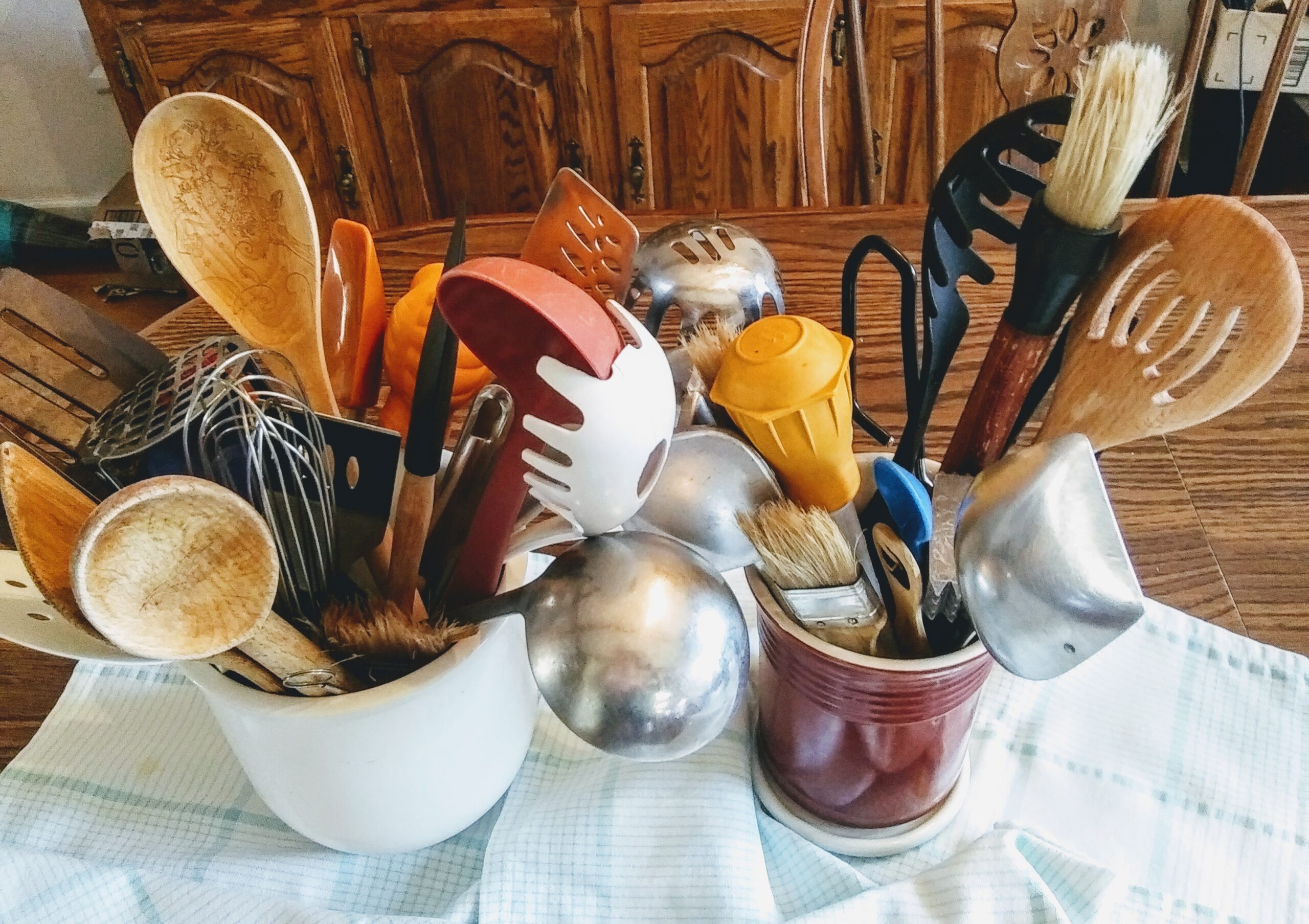 Two Kitchen Containers Full of Kitchen Tools